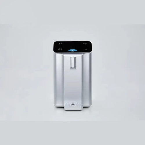 Silver countertop atmospheric water generator, straight-on front view with removable drip tray